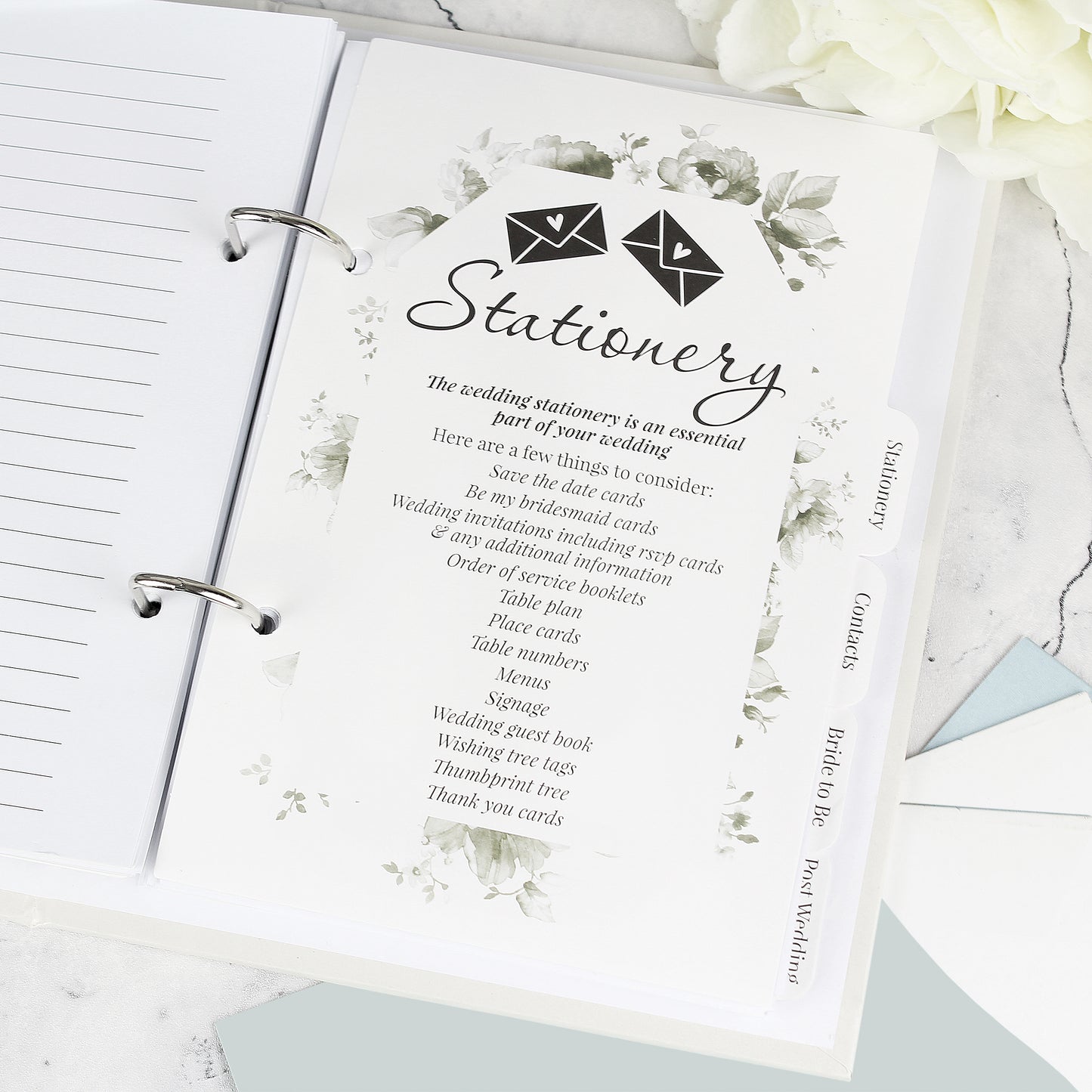 Stationery guide with floral design on a ring-bound notebook