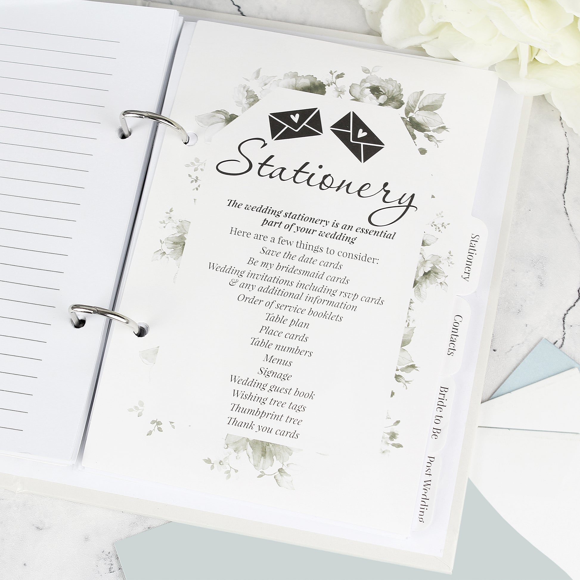 Stationery guide with floral design on a ring-bound notebook