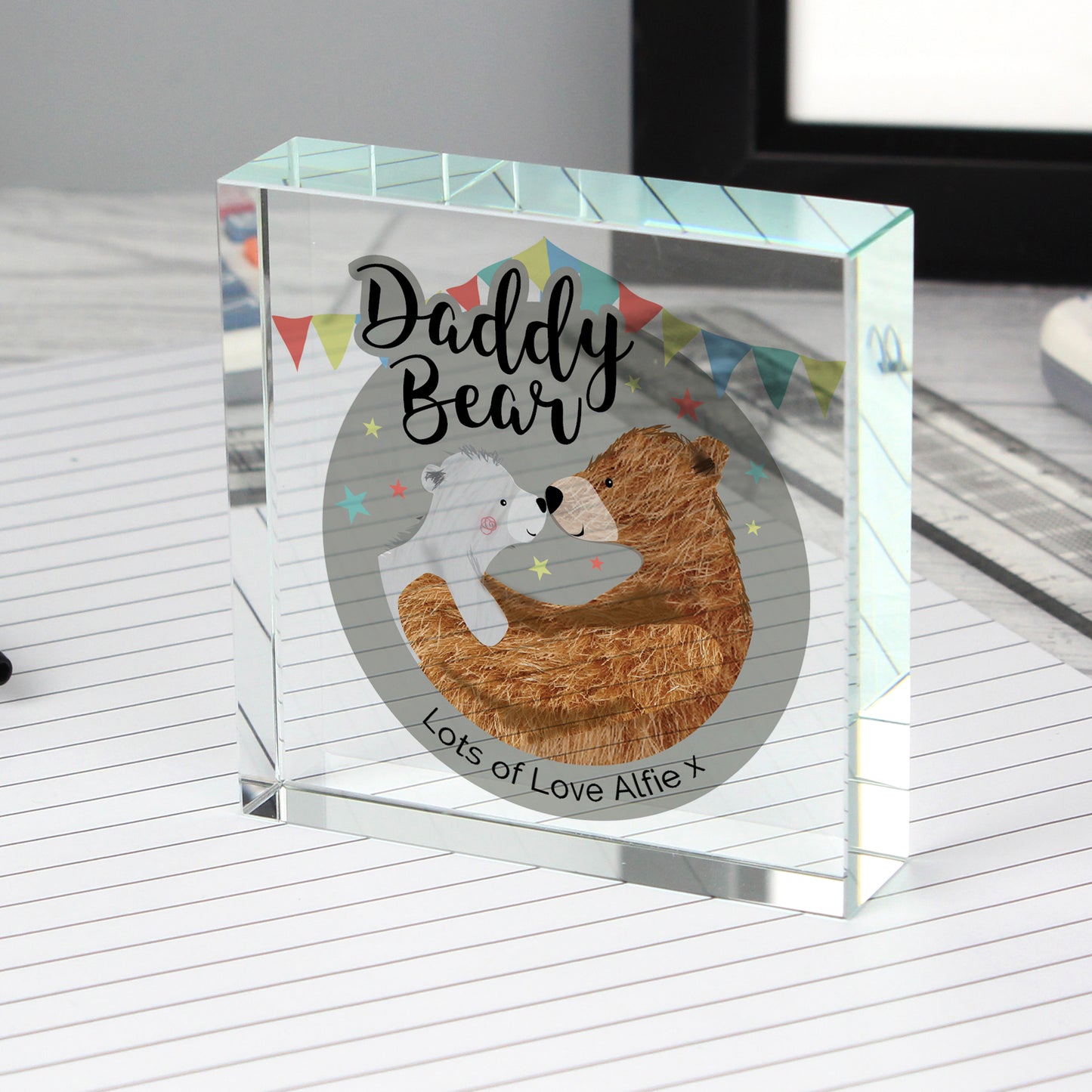 Glass block with 'Daddy Bear' design and text on a white surface