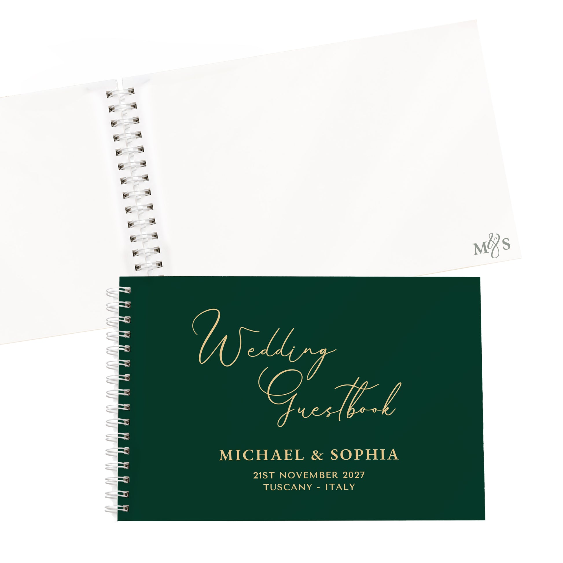 A personalised wedding guestbook with a dark green cover and gold foil lettering, shown in front of an open white page spread on a white background.