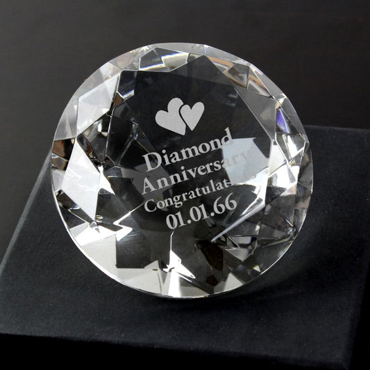 Clear paperweight with personalised diamond anniversary message on black background.