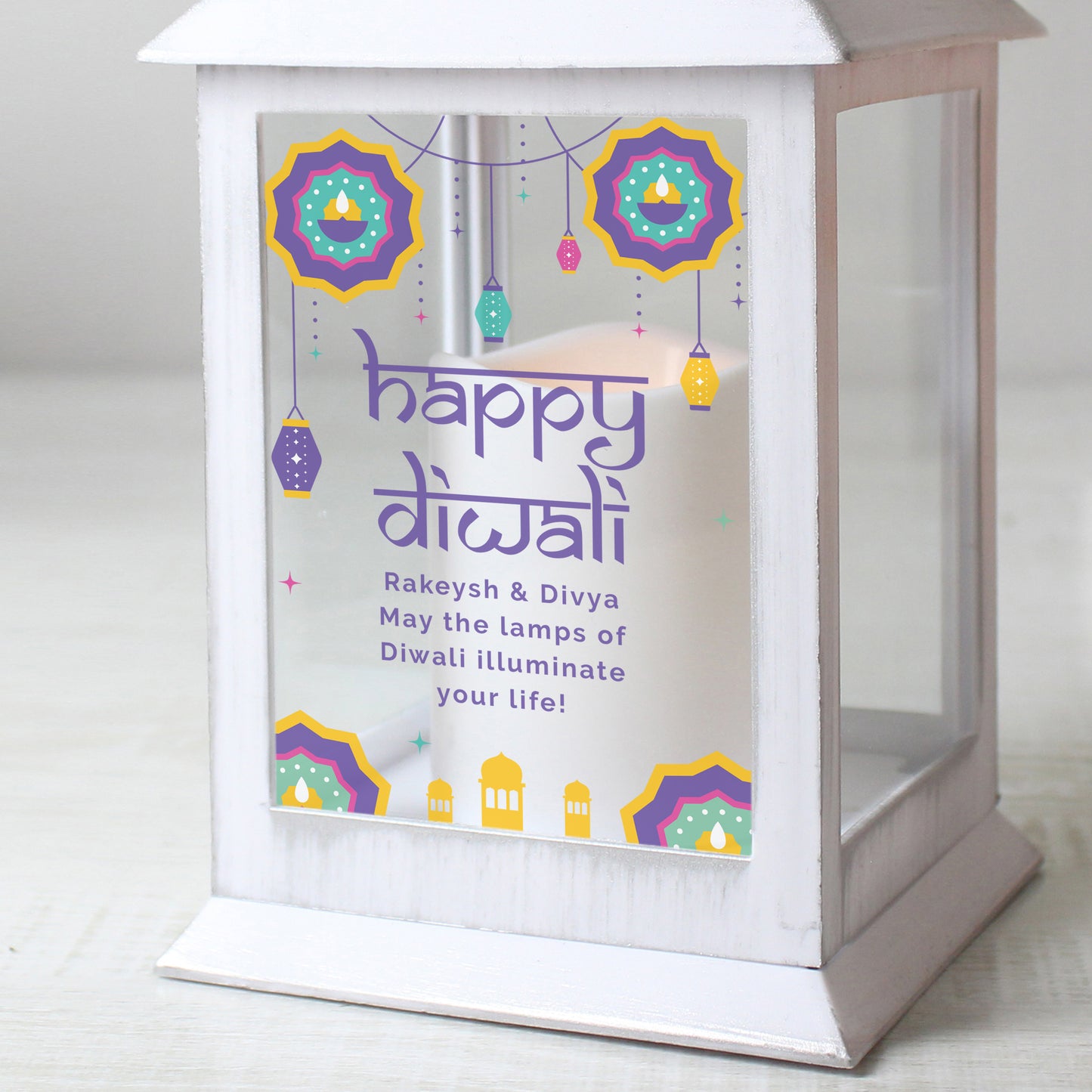 Close up image of lantern. Text reads - Rakeysh & Divya May the lamps of Diwali illuminate your life!