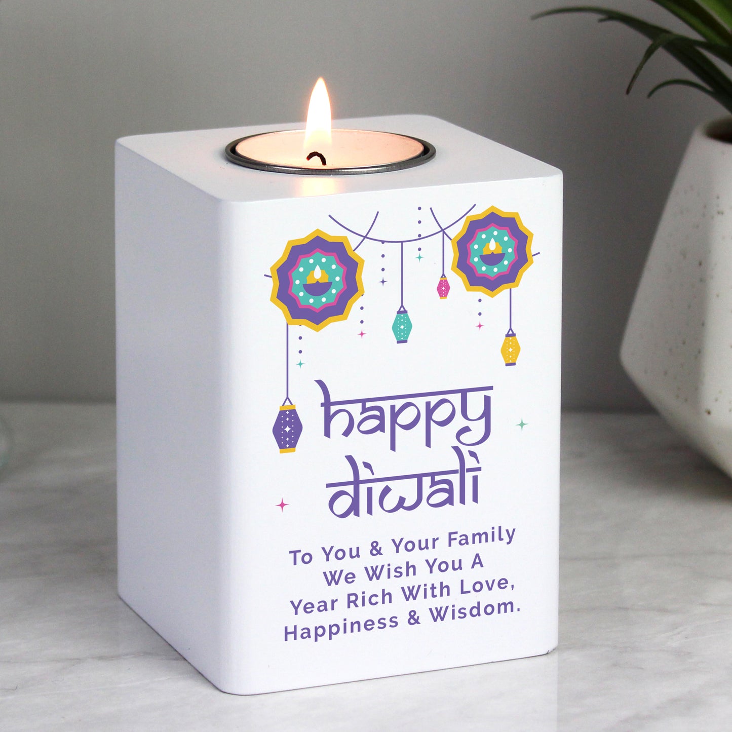 Personalised Diwali tealight holder shown on a worktop.