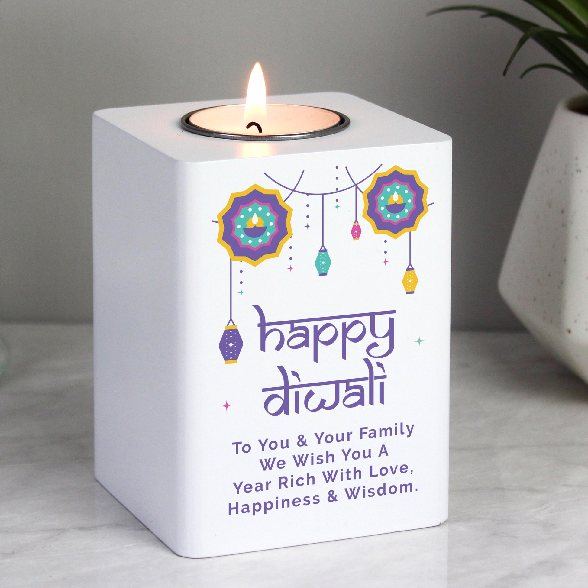 Personalised Diwali tealight holder shown on a worktop.