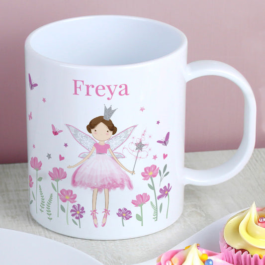 White mug with fairy design and 'Freya' text on a pink background