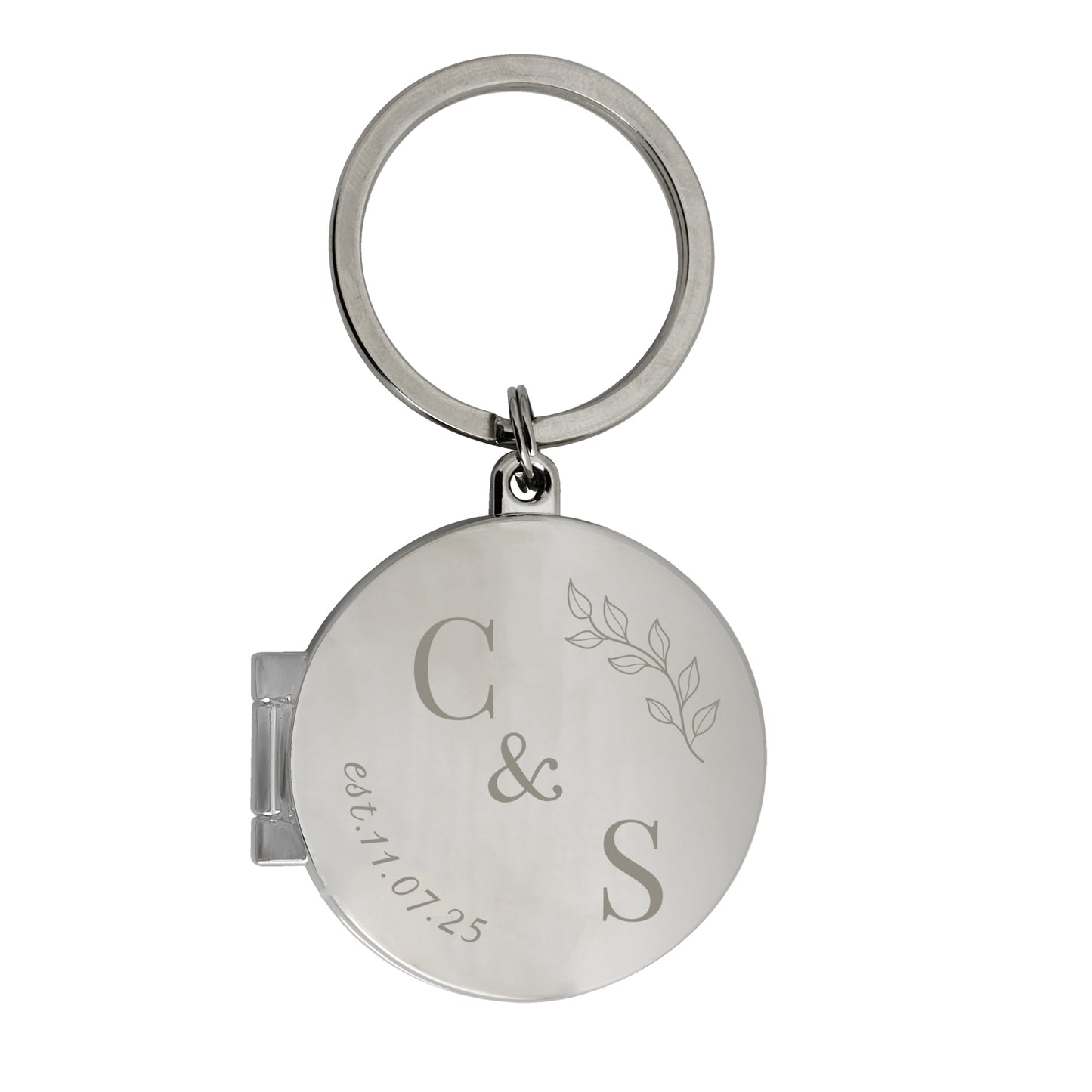 Silver keychain with engraved initials and date on a white background