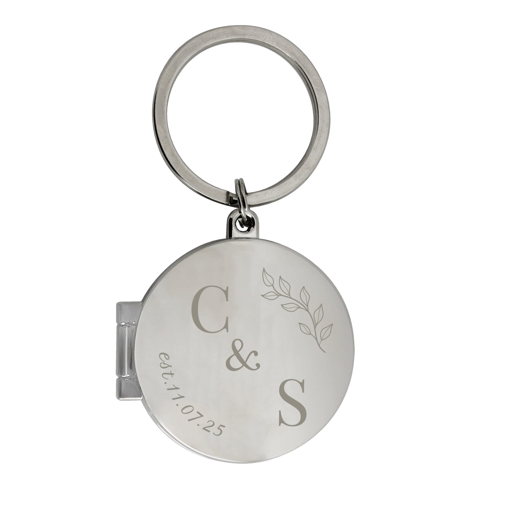Silver keychain with engraved initials and date on a white background