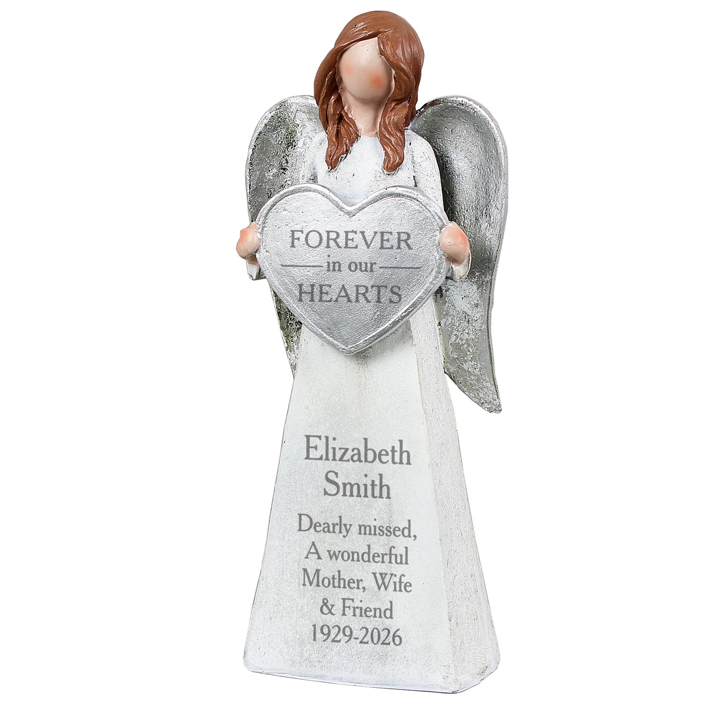 Angel figurine holding a heart-shaped plaque with engraved text on a white background