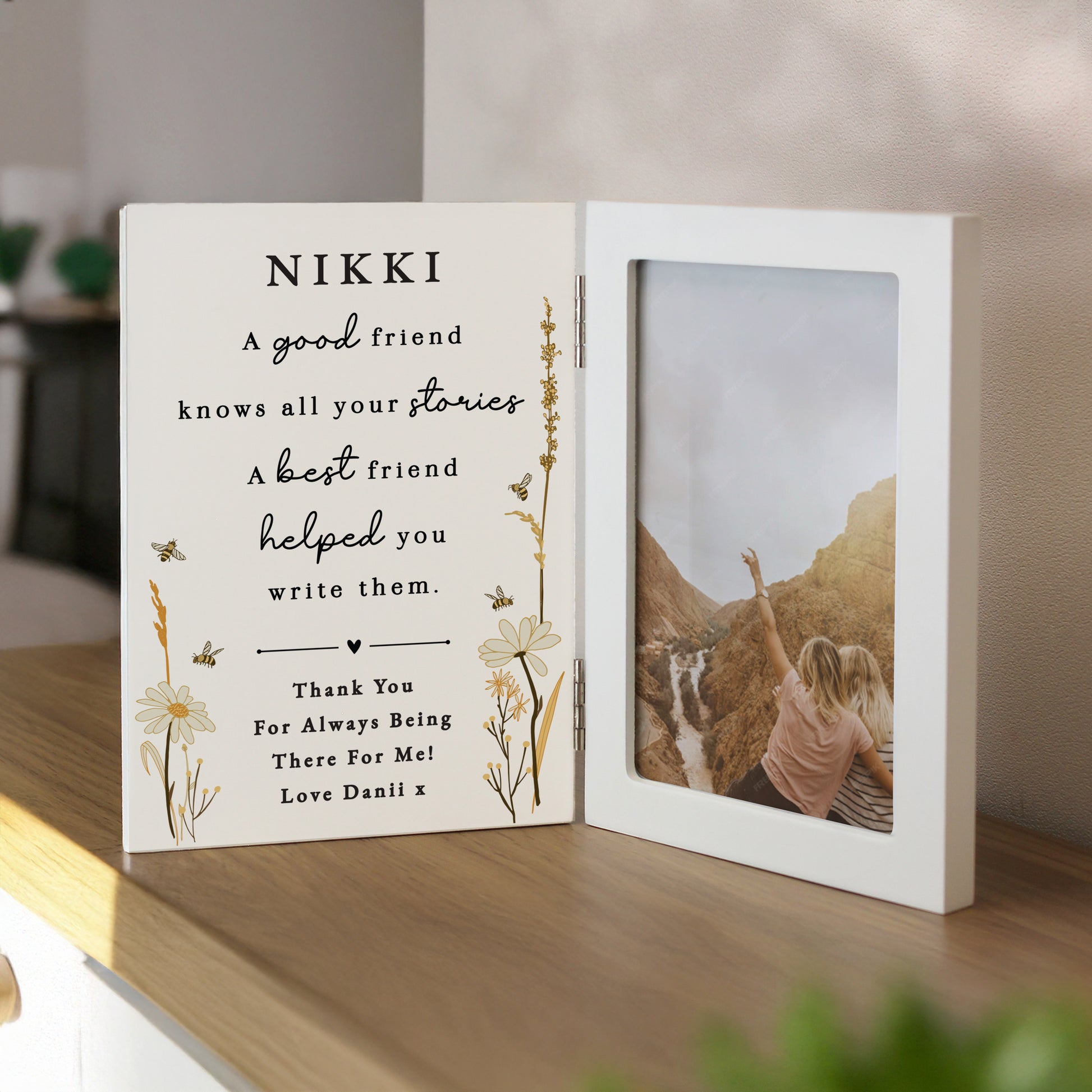 Personalised photo frame with a message and a photo of two people on a mountain.