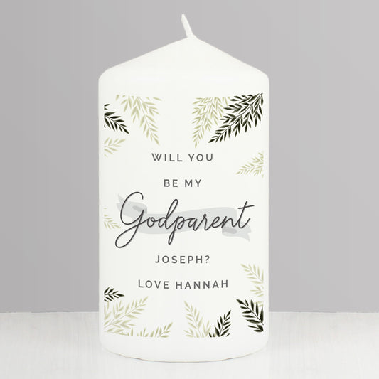 White candle with 'Will you be my Godparent' text and leaf patterns on a gray background
