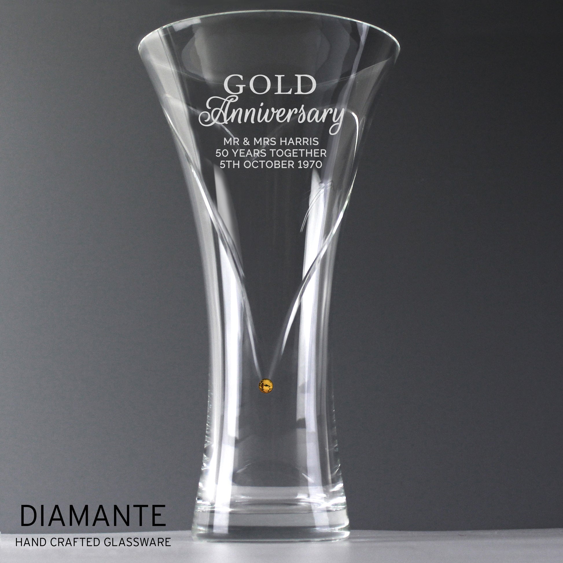 Clear glass vase with engraved Gold Anniversary text on a grey background, featuring the brand 'Diamante'.