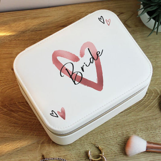 White jewelry box with 'Bride' design on a wooden surface