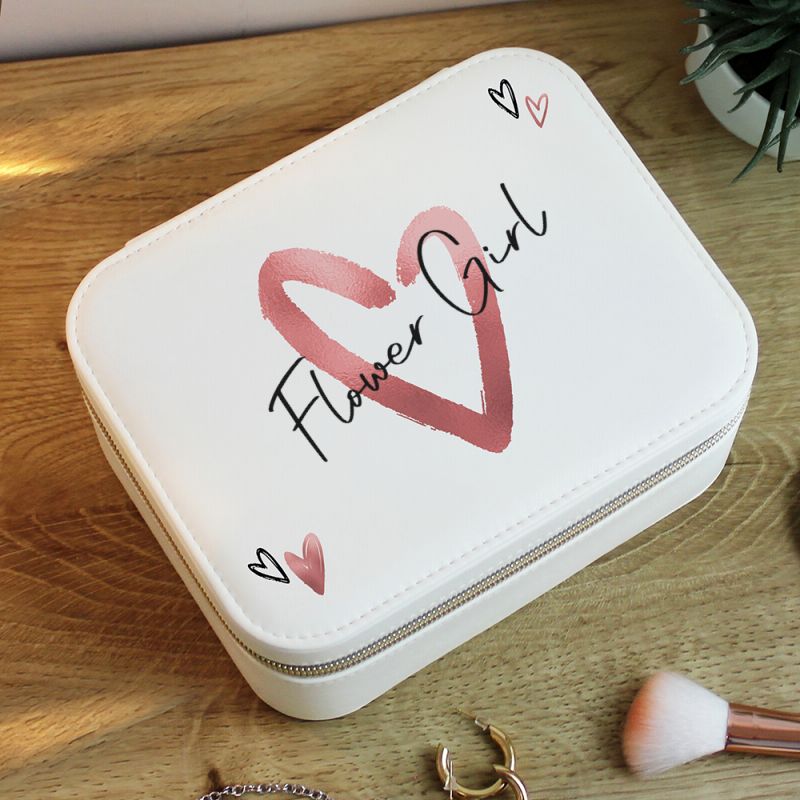 White jewelry box with 'Flower Girl' design on a wooden surface
