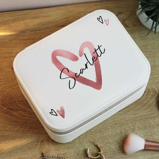 White jewelry case with 'Scarlett' design on a wooden surface