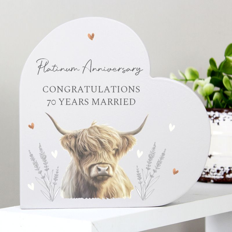 Plaque with a highland cow illustration and 'Platinum Anniversary Congratulations 70 Years Married' text on a white background.