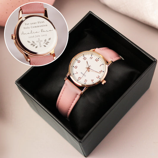 Pink watch with rose gold case in a black box, inset showing engraved message.