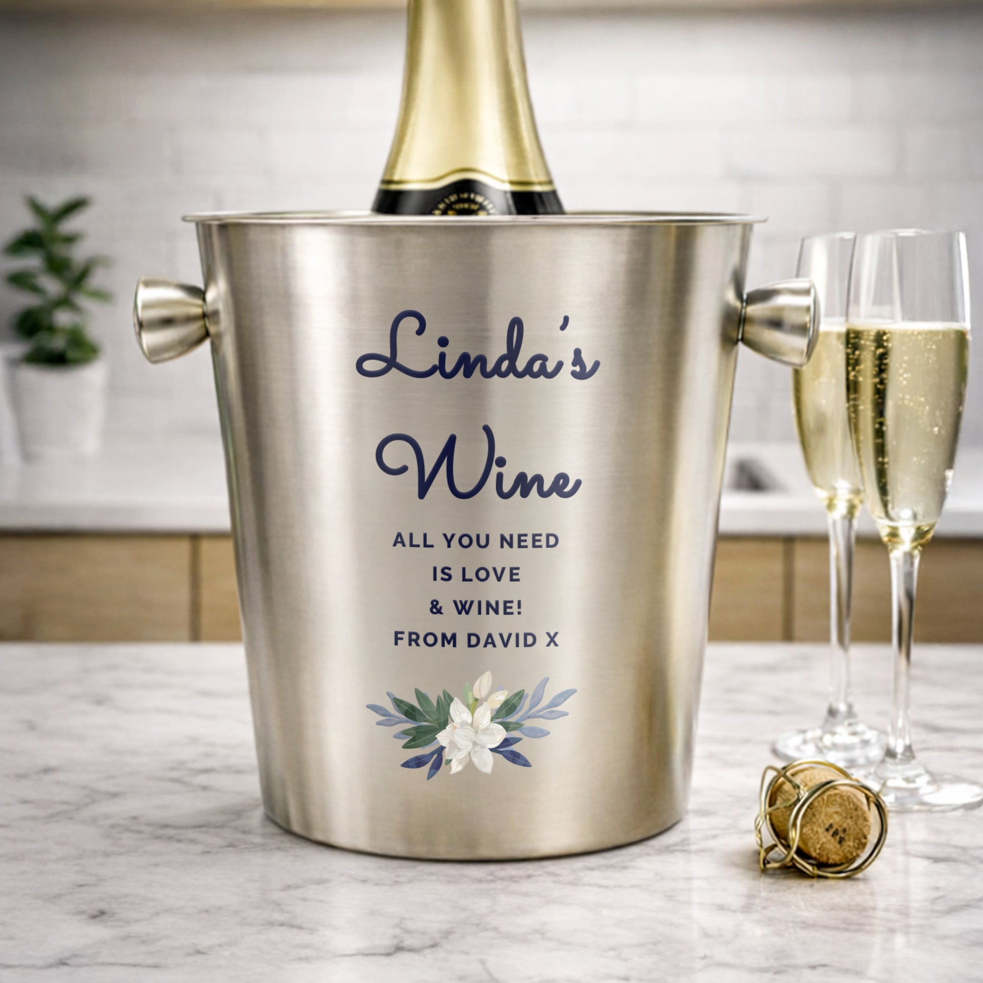 Personalised wine cooler with champagne and glasses on a marble surface. Champagne & Glasses not included.