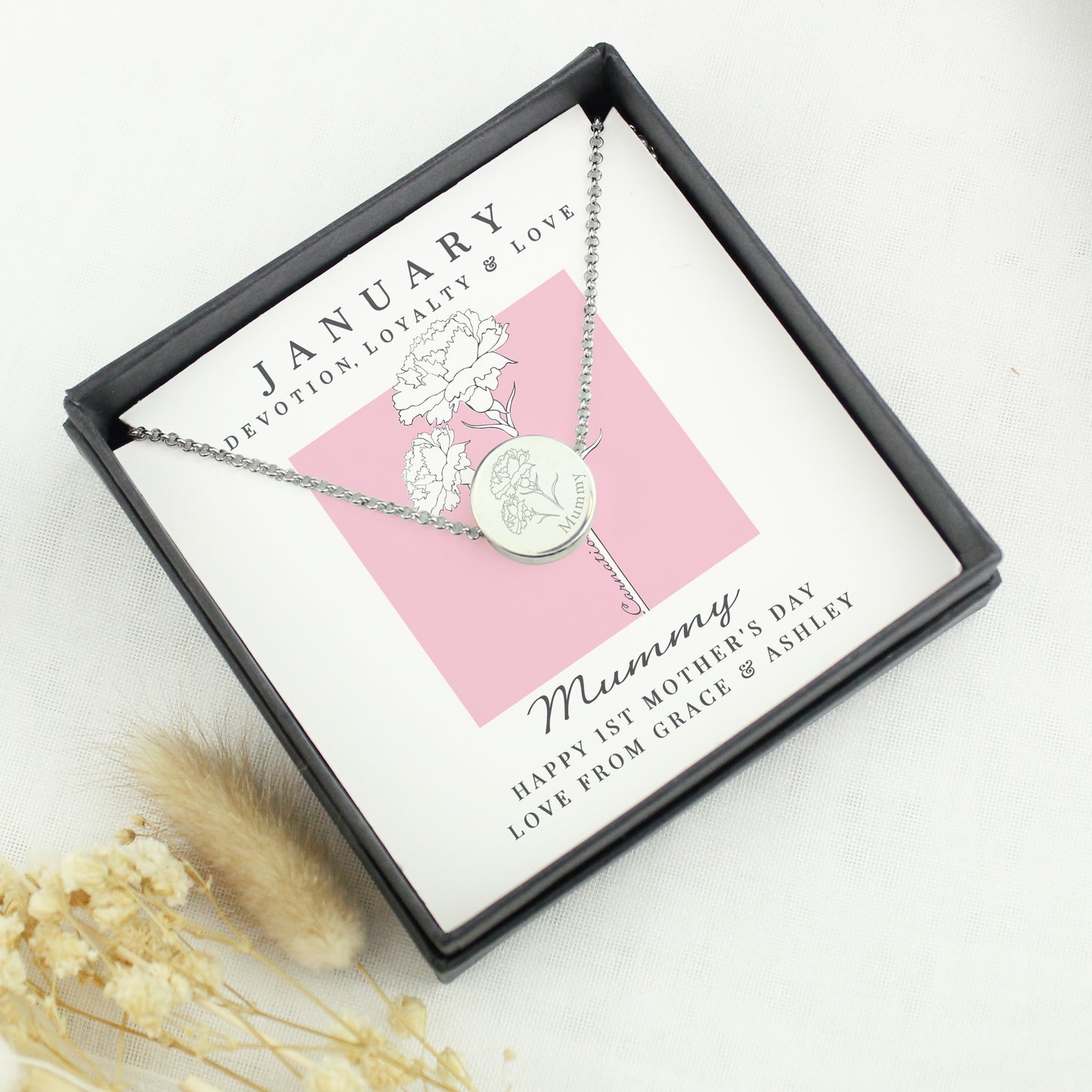 Necklace in a gift box featuring the month of January and flower engraving.