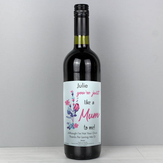 Wine bottle with a personalised label on a grey background