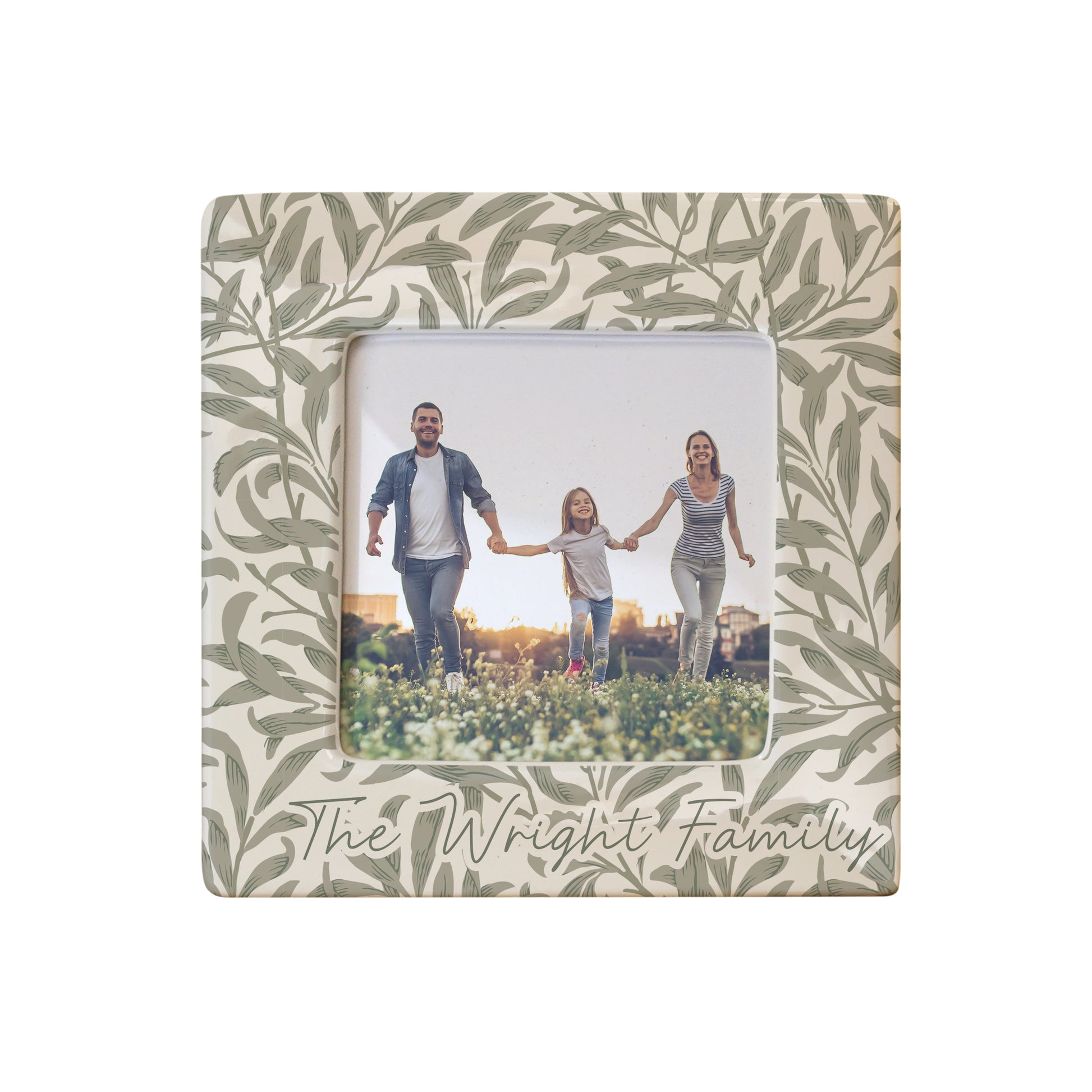 Decorative photo frame with leaf pattern and family photo inside