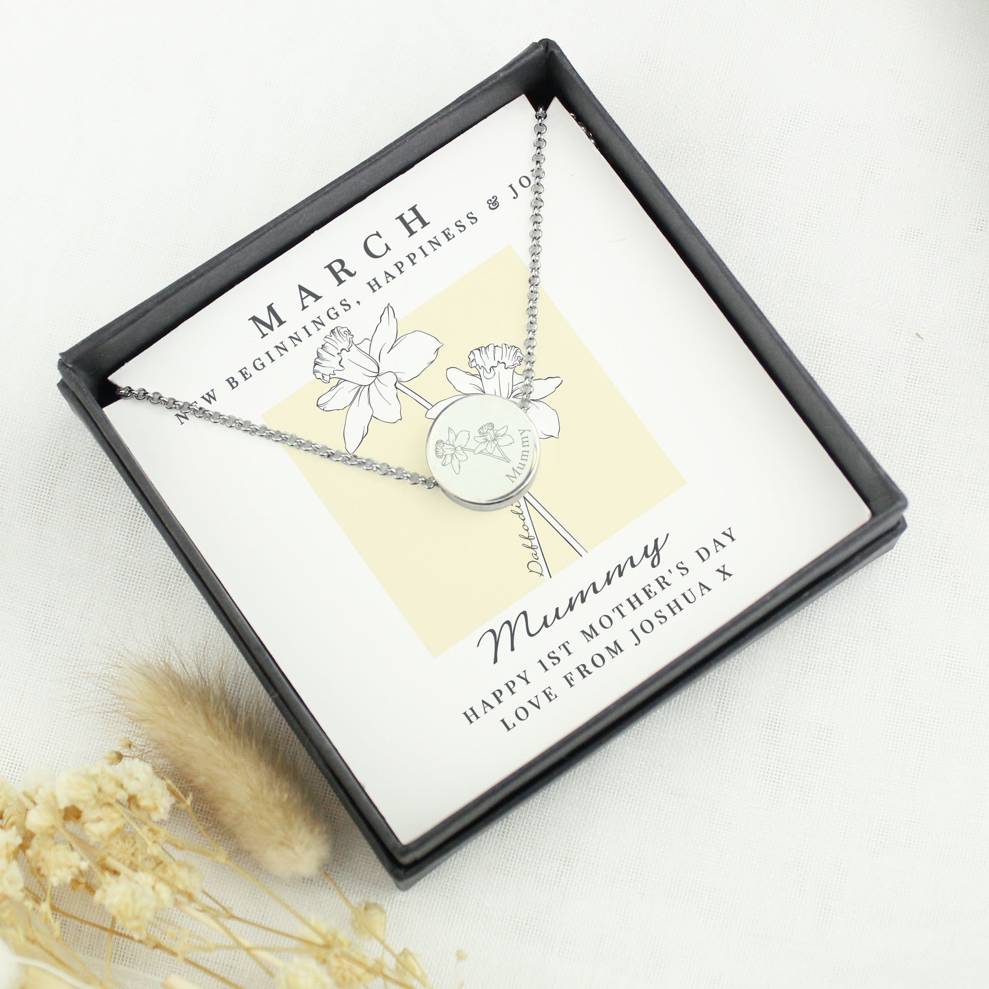Silver necklace with floral design in a gift box, featuring a personalised message.