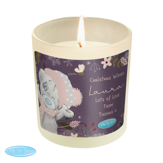 Candle with a decorative label featuring a cartoon character on a white background