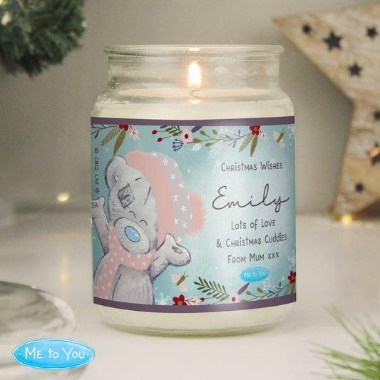 Candle in a jar with a personalised label featuring cartoon characters and text.