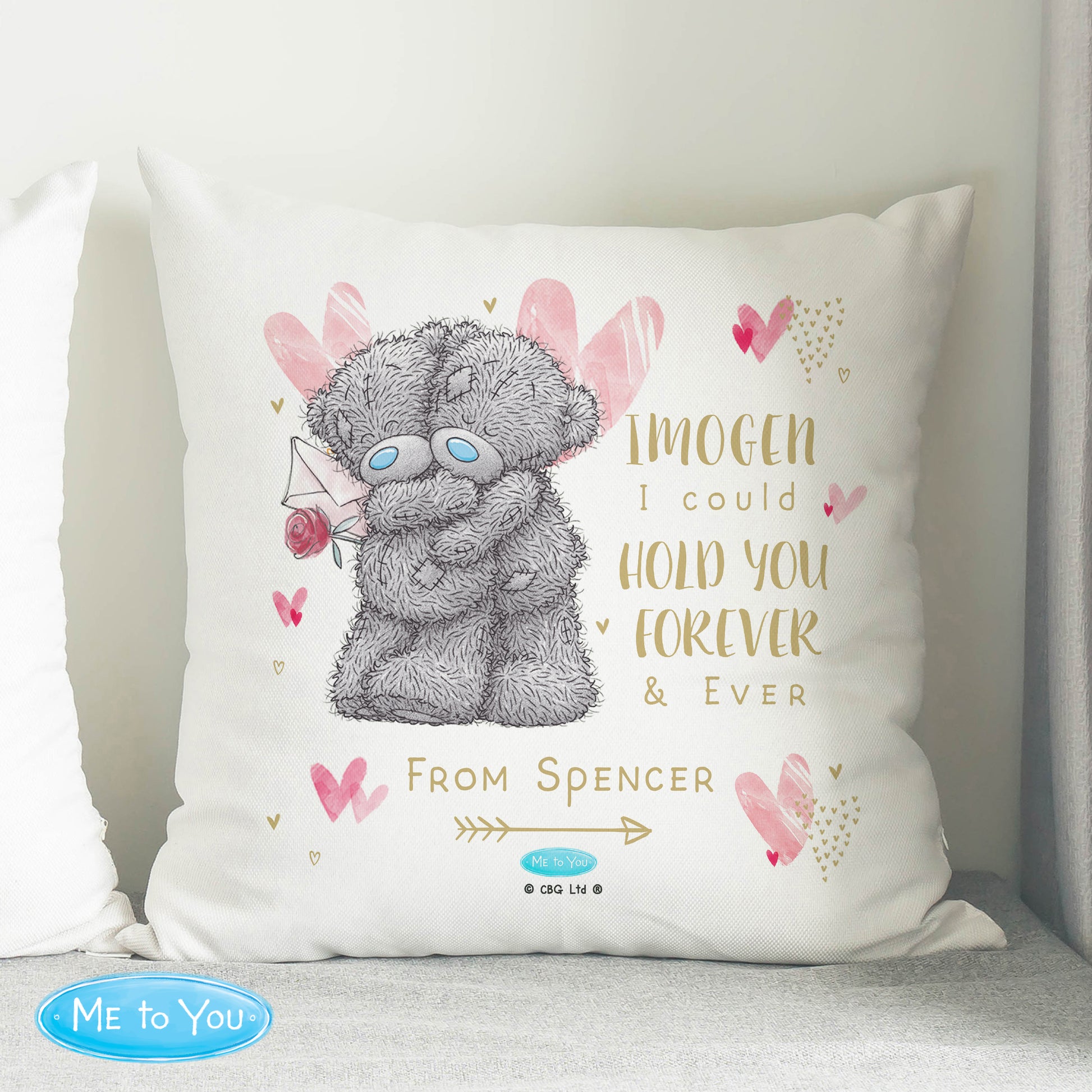 Decorative pillow with a teddy bear illustration and personalised text on a white background.