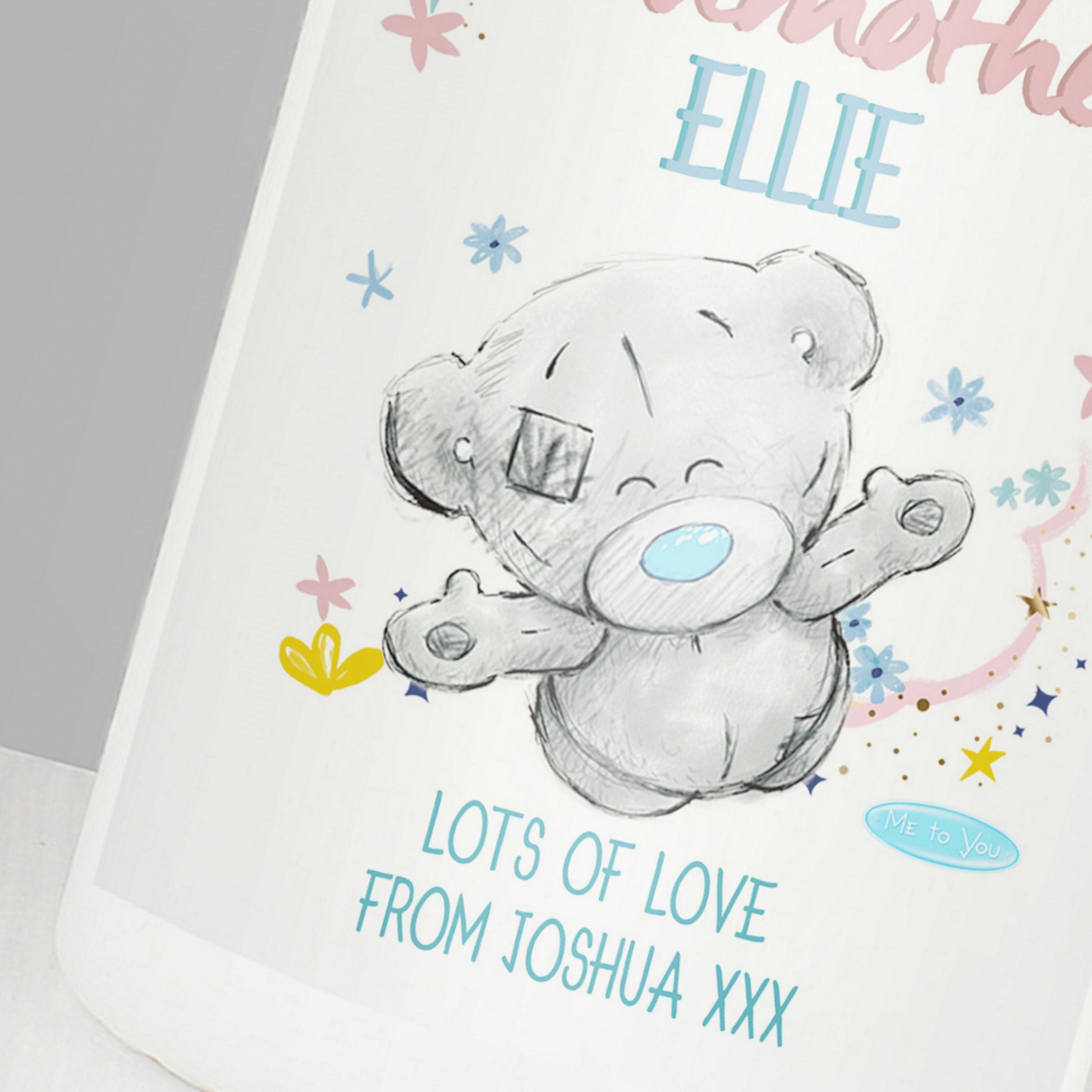 Card with a teddy bear illustration and personalised text on a white background