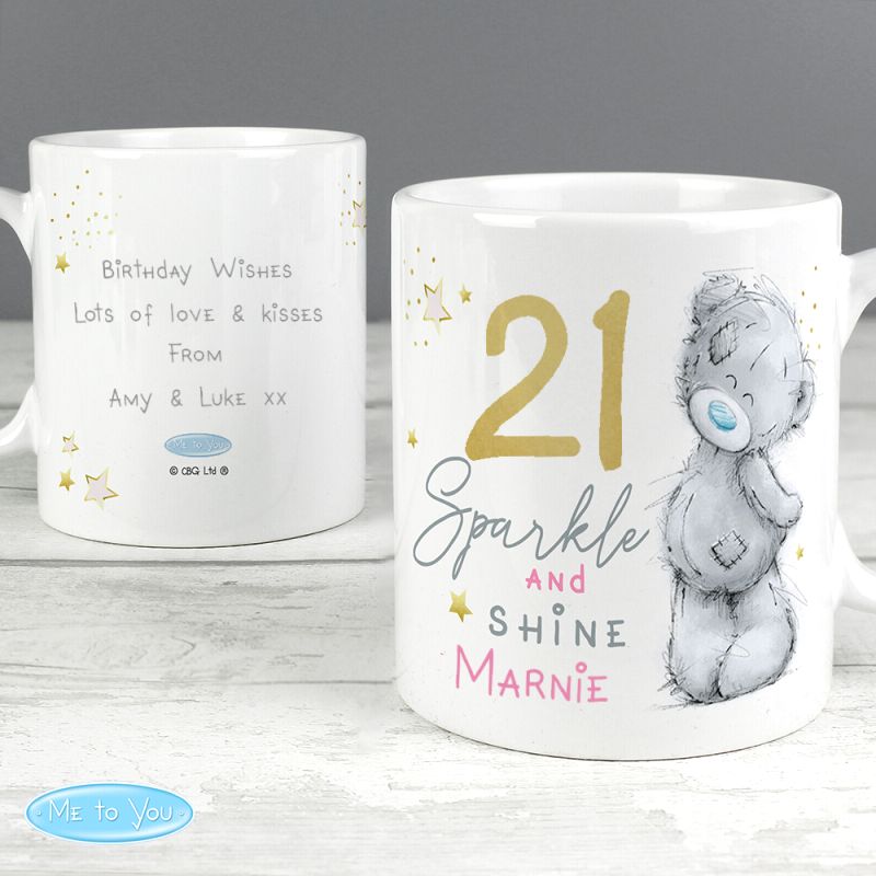White personalised mug with text and a bear illustration on a wooden surface.