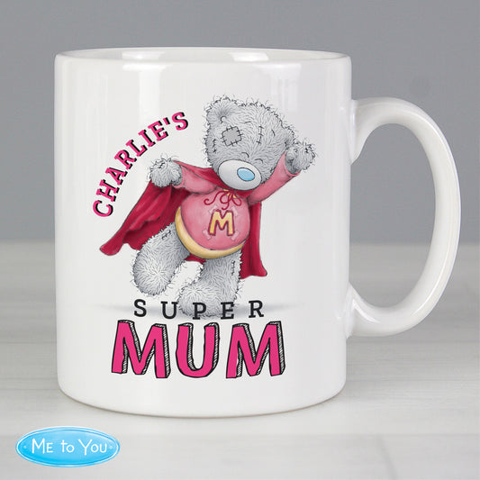 White mug with a teddy bear wearing a red cape and 'Super Mum' text, on a gray background.