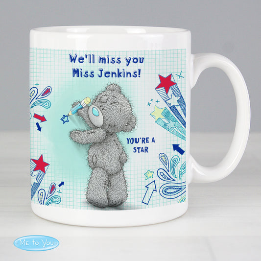 Mug with a teddy bear design and text on a light gray background