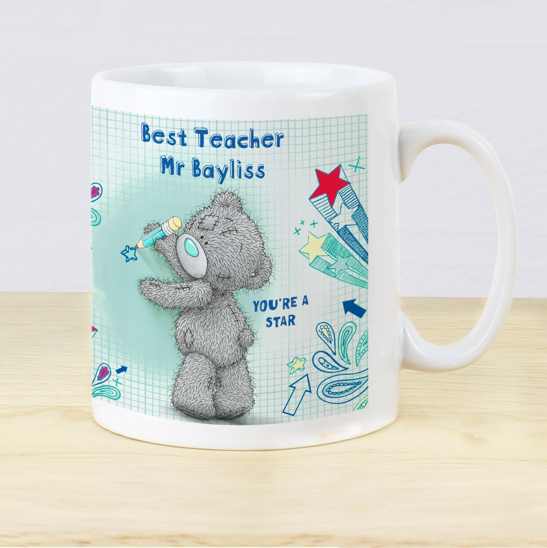 Mug with teddy bear design and personalised text on a light background