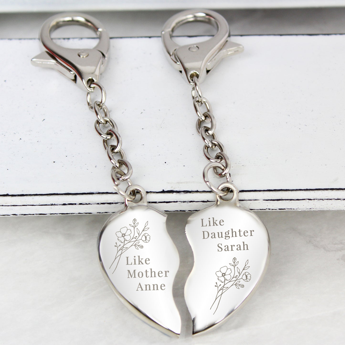 Personalised Mother Daughter Keyring showing both keyrings on a table top.