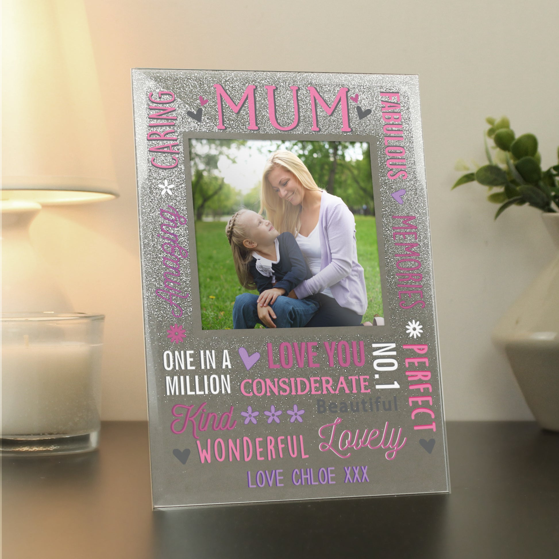 Personalised Mum Glitter Frame in diamante with mirrored effect. With white and pink slogans around the aperture and the word Mum at the top centre.