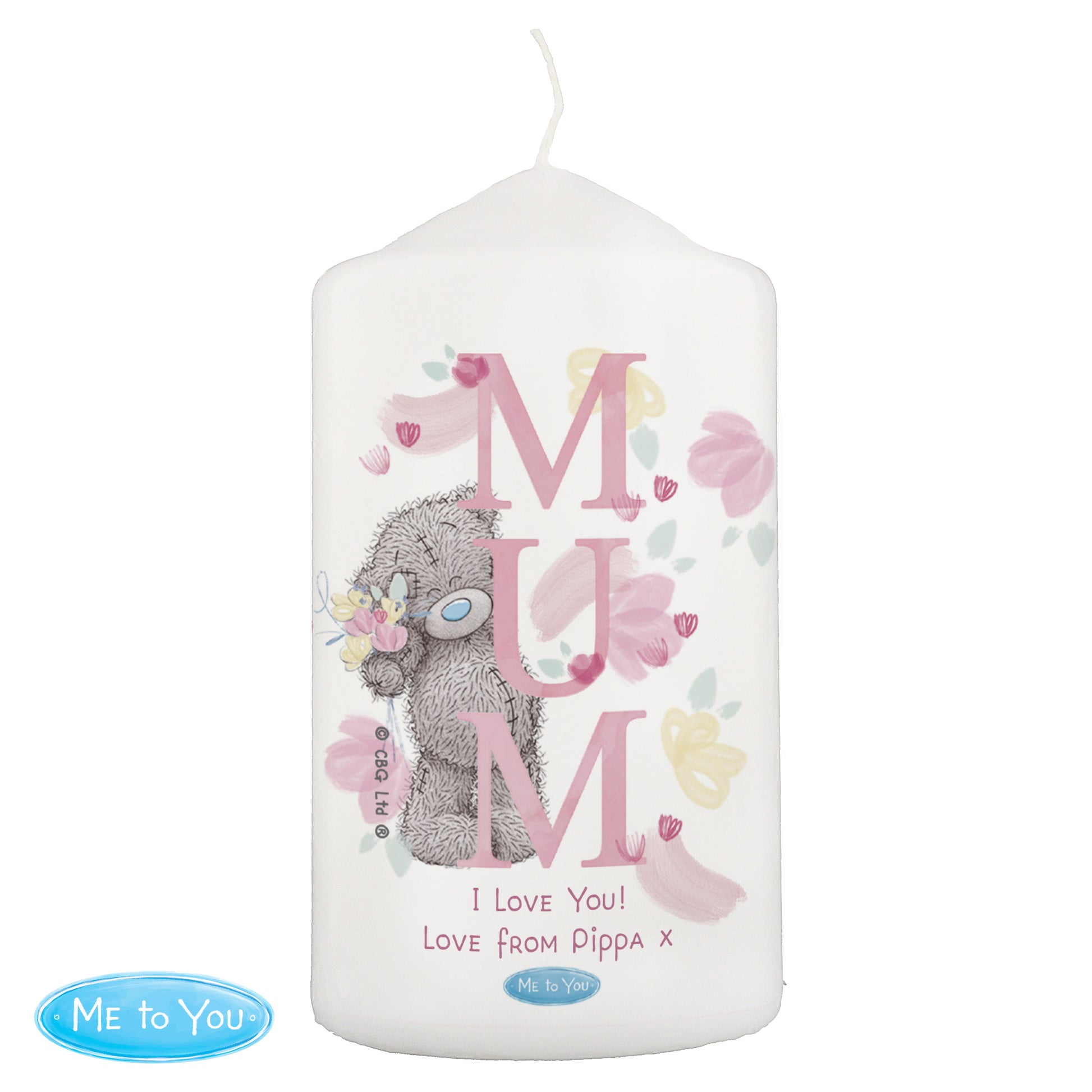 Candle with 'MUM' text and teddy bear design on a white background