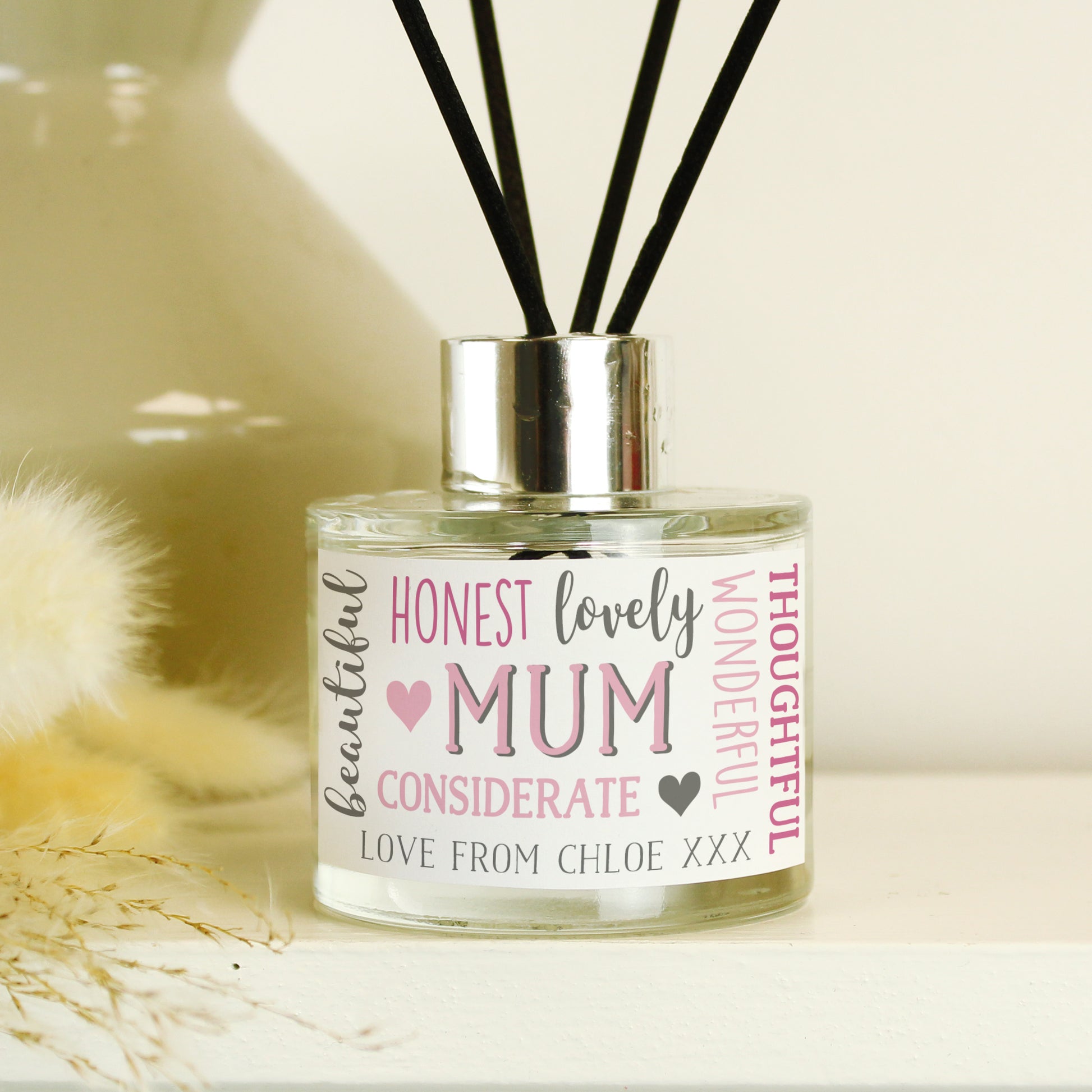 Diffuser with a personalised label on a neutral background