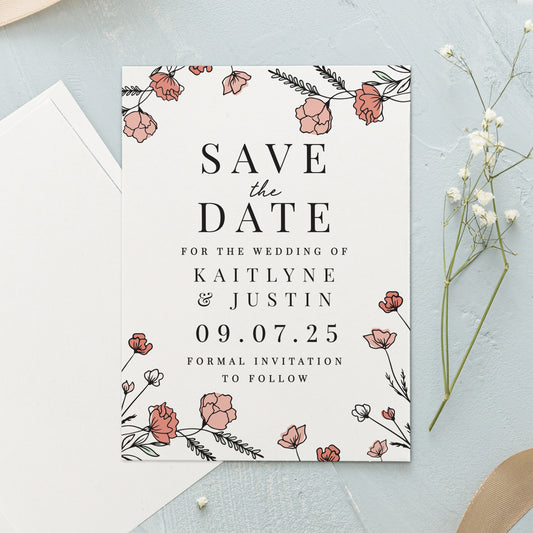 Save the date card with floral design on a light blue background