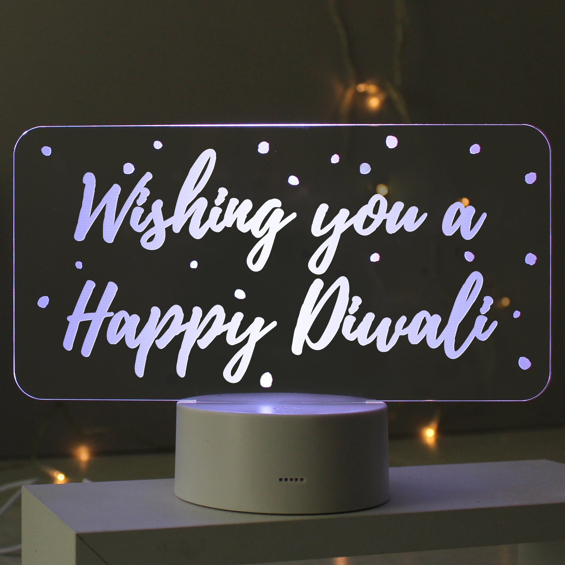 Personalised clear ' Wishing you a happy Diwali' sign on grey base.