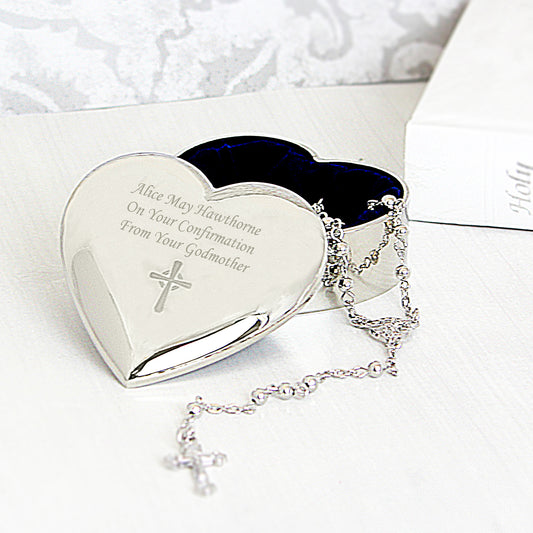 Heart-shaped silver trinket box with engraved text and a necklace on a white background