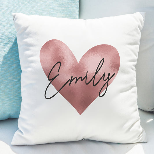 Cushion in white with rose gold heart design and personalised name.