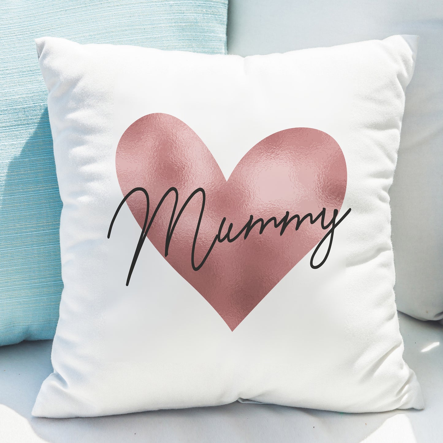 Cushion in white with rose gold heart design and personalised name.