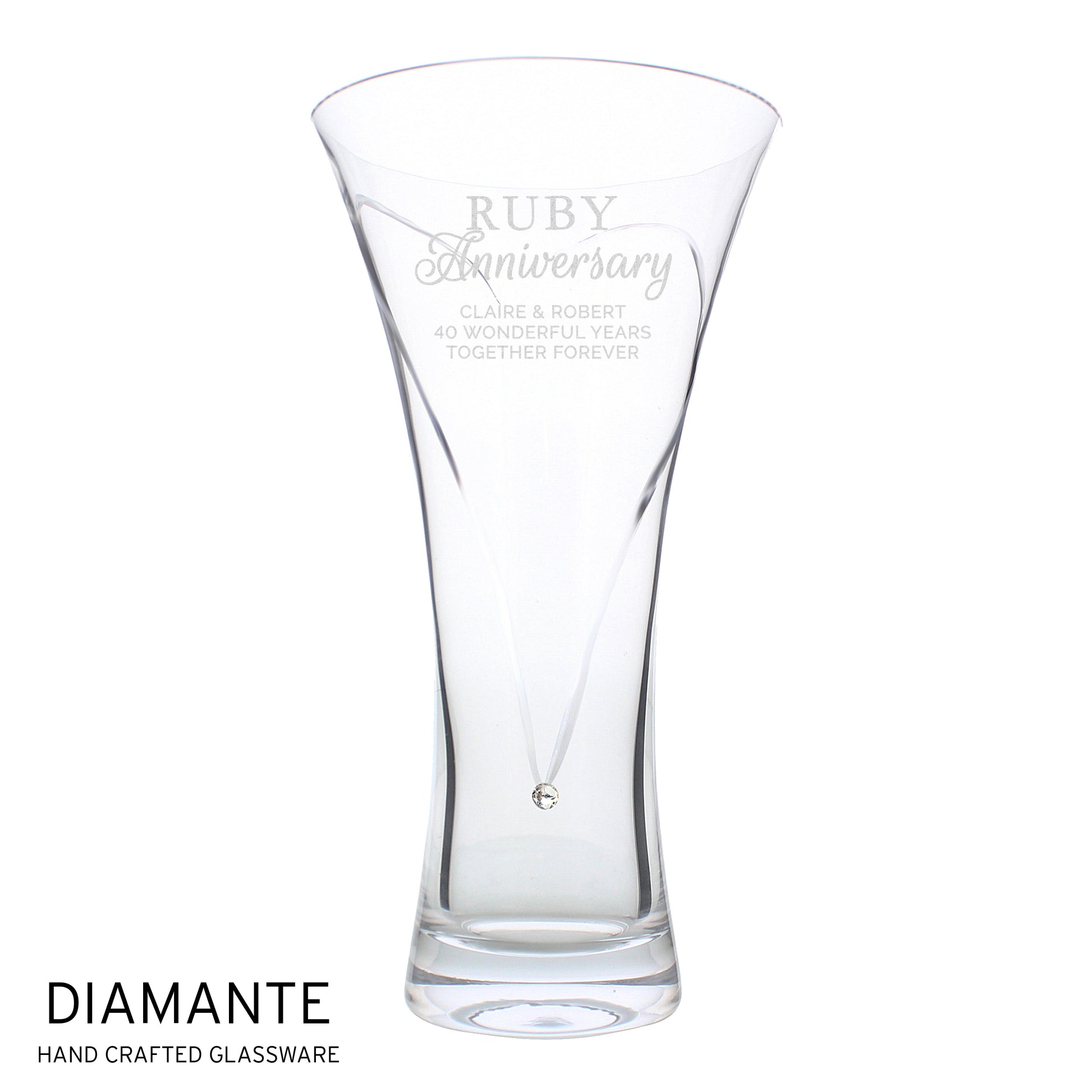 Clear glass vase with engraved text on a white background