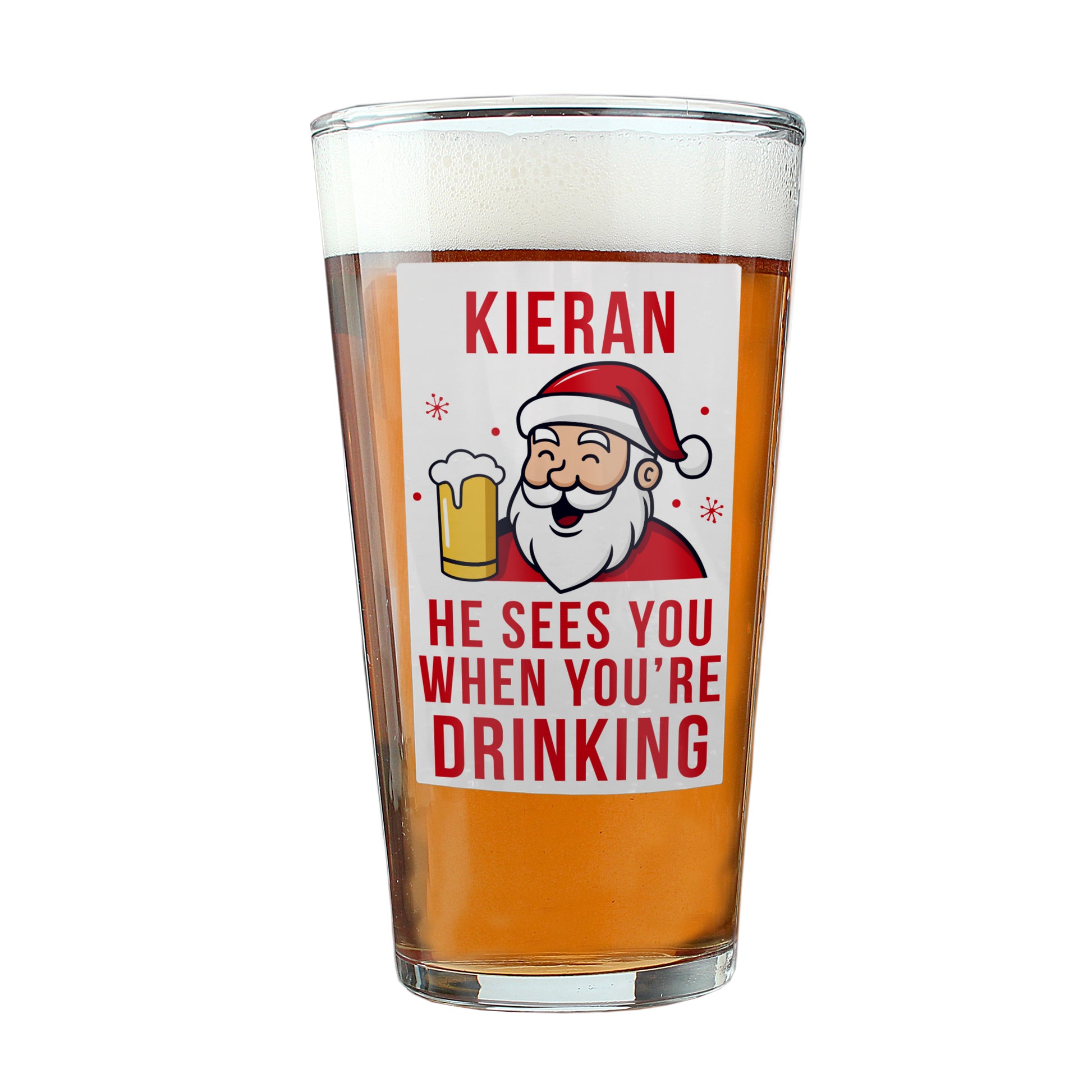 Pint glass with a printed design of a Santa Claus character and text, filled with beer.