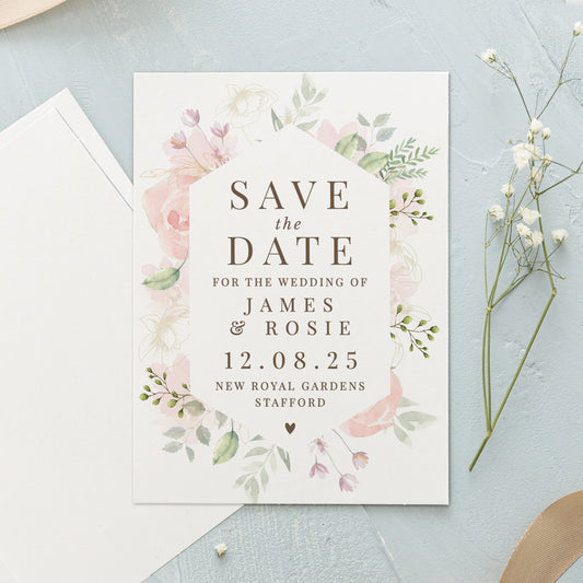 Wedding save the date card with floral design on a light blue background
