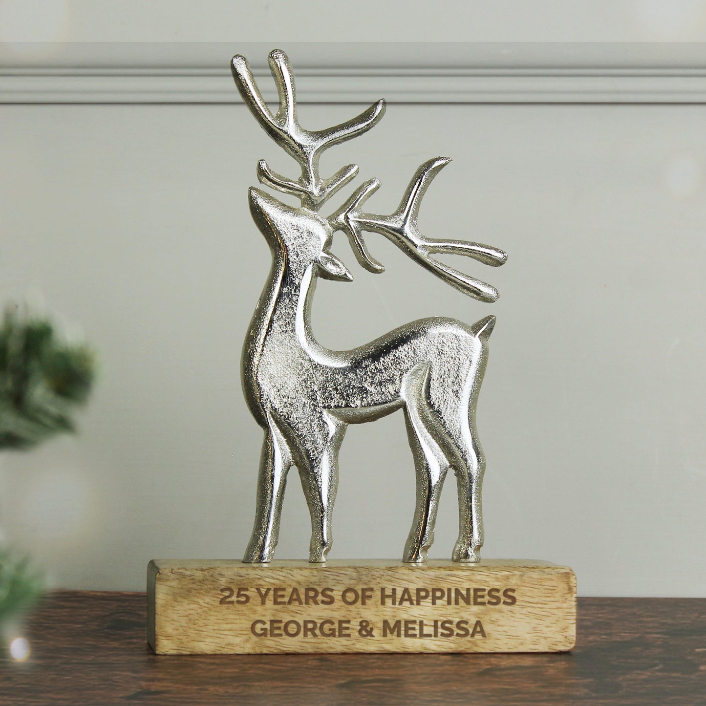 Silver stag figurine on a wooden base with '25 Years of Happiness George & Melissa' text.