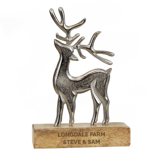 Decorative deer figure on a wooden base with 'Longdale Farm Steve & Sam' engraving.