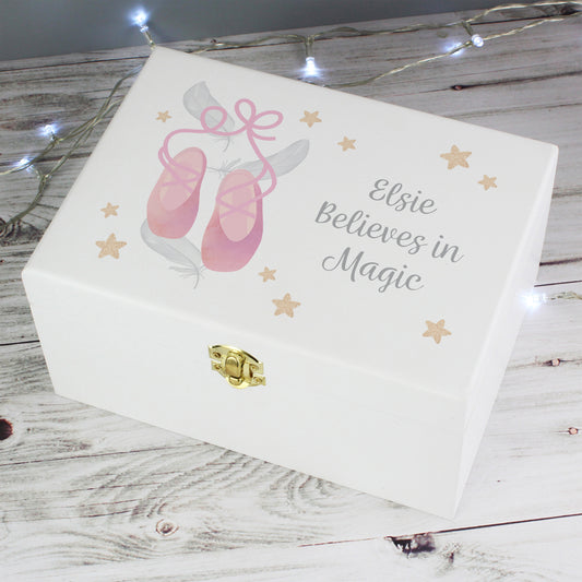 White jewelry box with pink ballet shoes and 'Elsie Believes in Magic' text on a wooden surface.