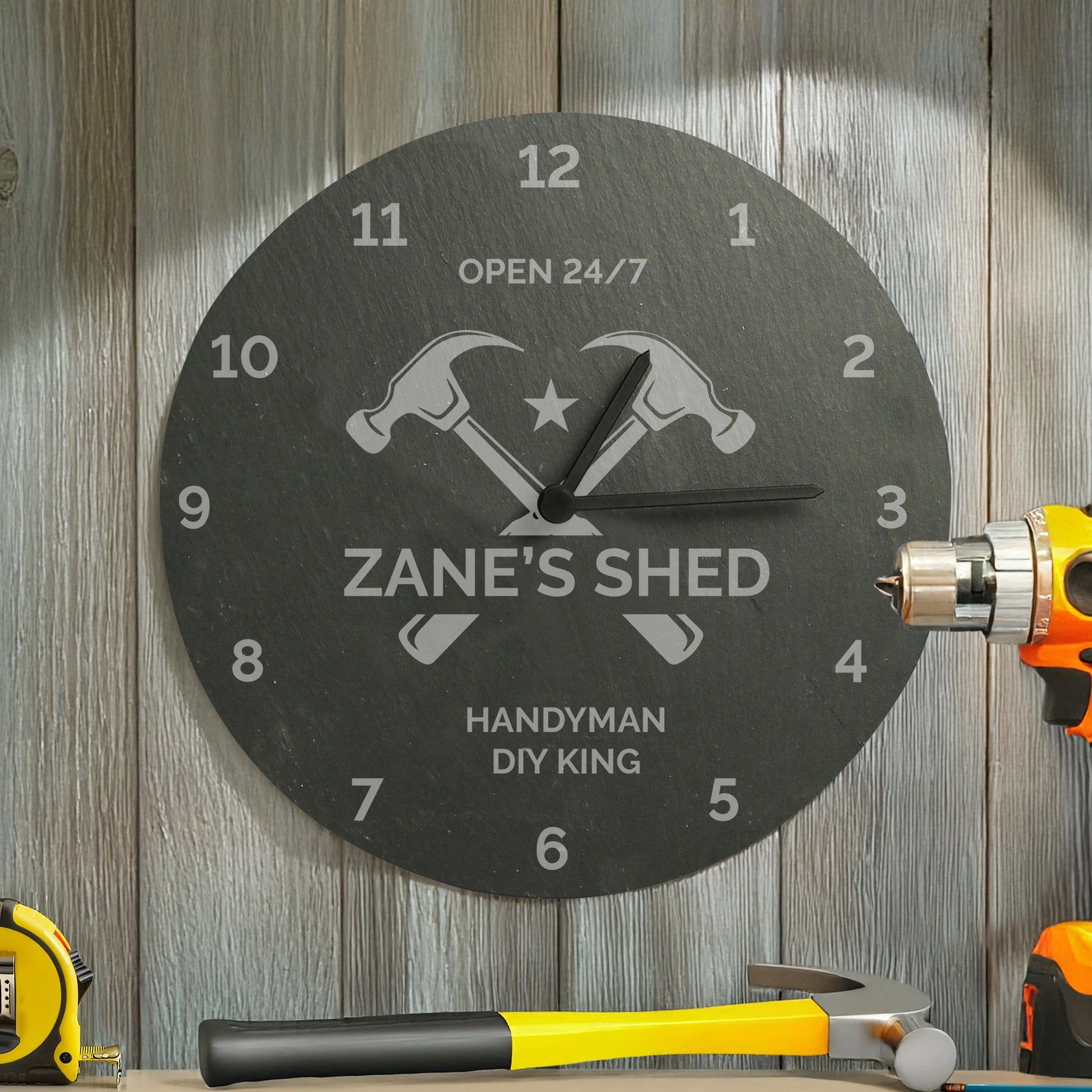 Wall clock with 'Zane's Shed' and 'Handyman DIY King' text, surrounded by tools on a wooden background.