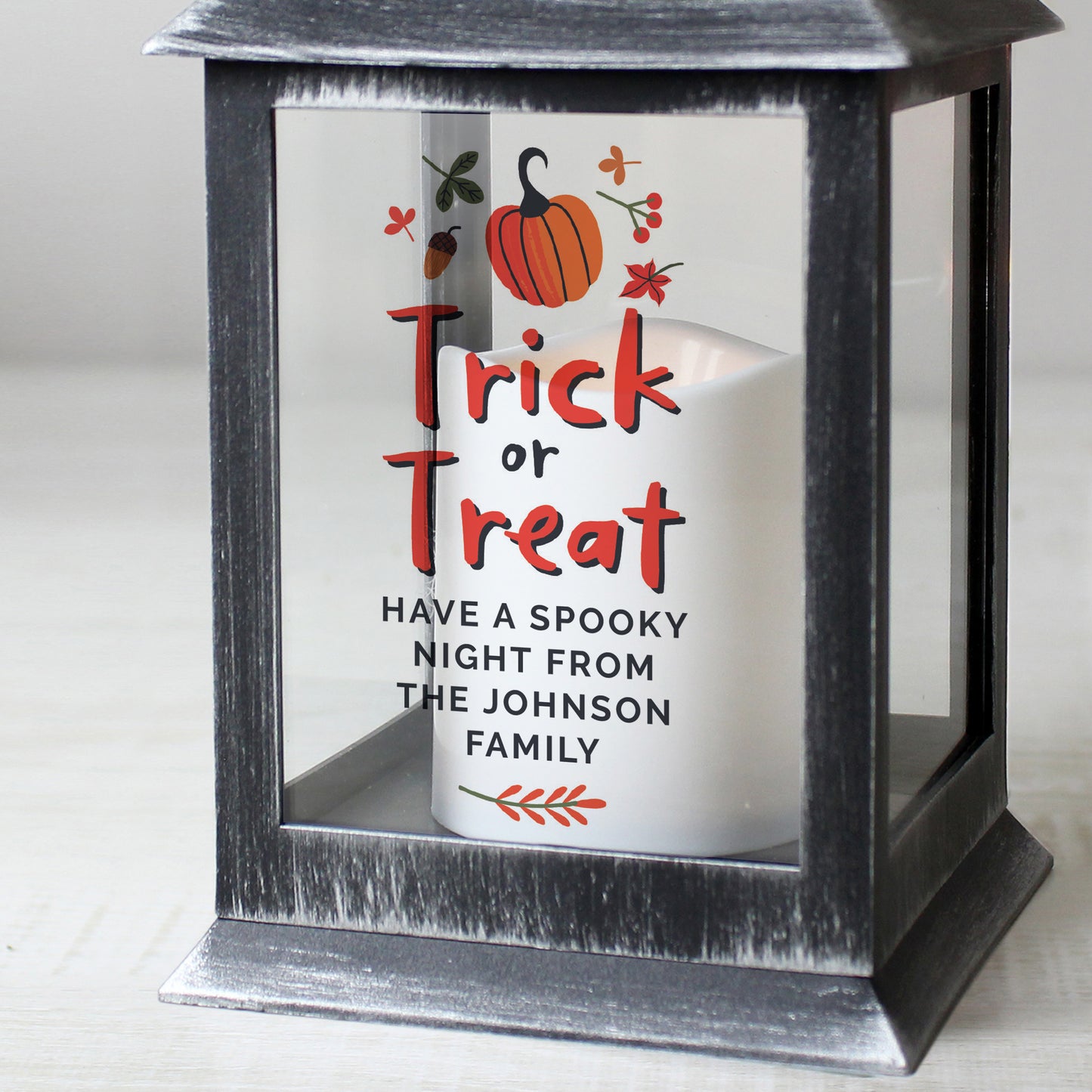 Black lantern with 'Trick or Treat' message and personalised text on a white background
